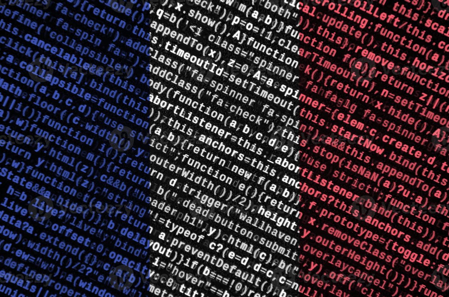 France flag is depicted on the screen with the program code. The concept of modern technology and site development photo