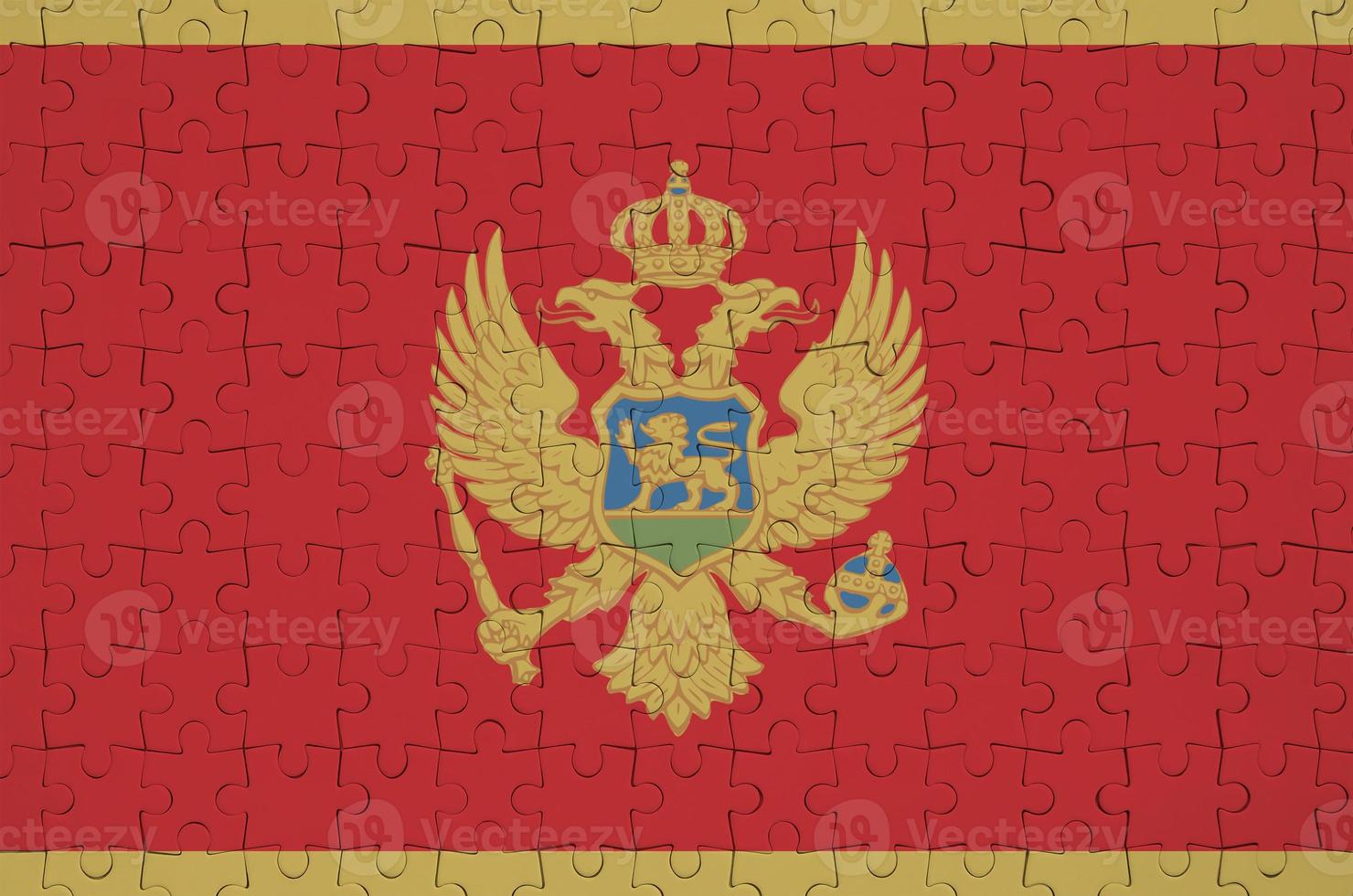 Montenegro flag is depicted on a folded puzzle photo