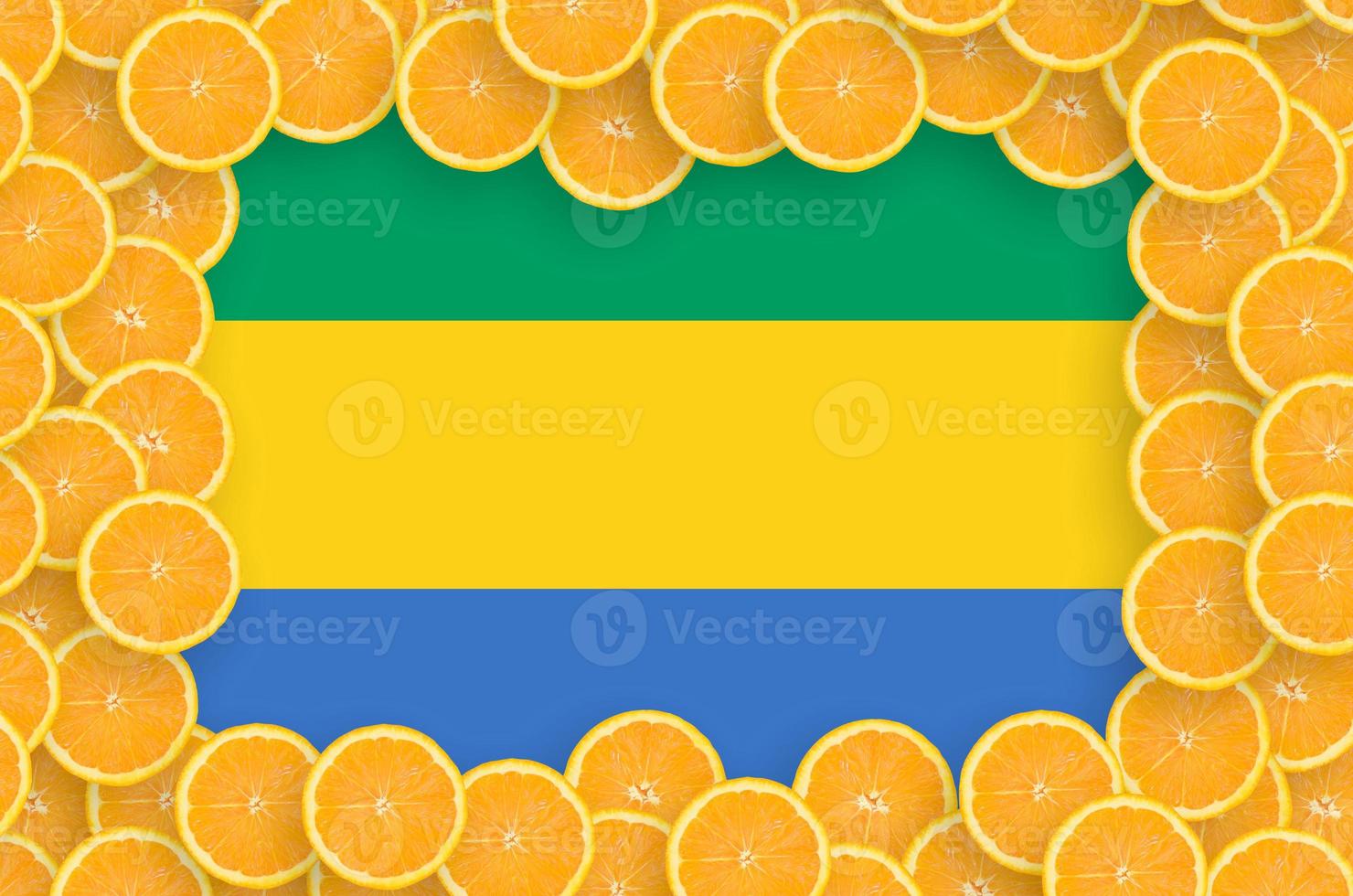 Gabon flag in fresh citrus fruit slices frame photo
