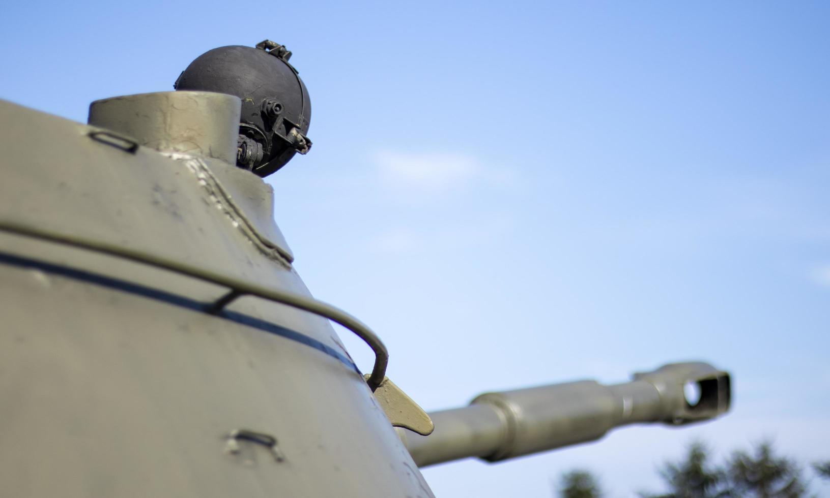 Tower of an armored personnel carrier or tank. Heavy weapons of war, sky background. Army equipment for combat and defense. Cannon tower. Details of military equipment. Close-up. photo