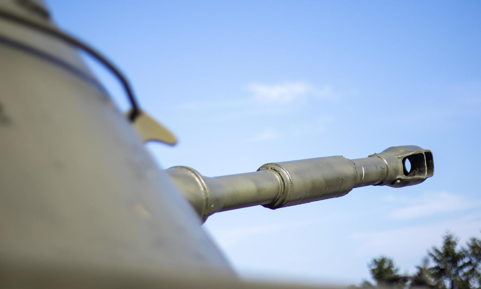 Tower of an armored personnel carrier or tank. Heavy weapons of war, sky background. Army equipment for combat and defense. Cannon tower. Details of military equipment. Close-up. photo