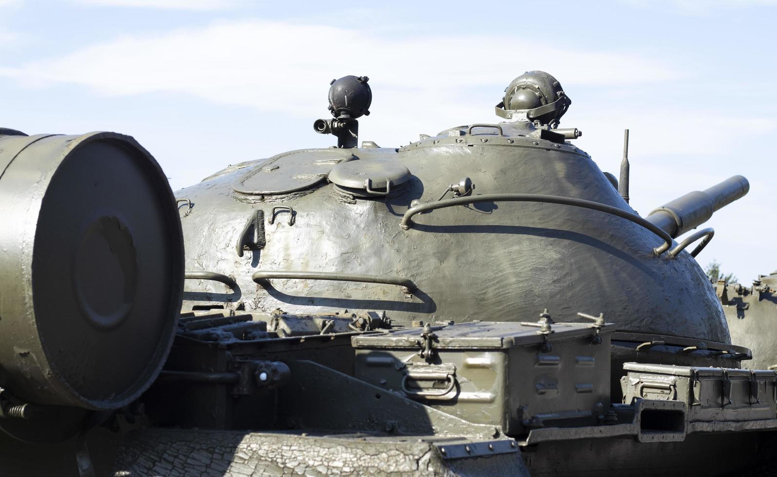 Tower of an armored personnel carrier or tank. Heavy weapons of war, sky background. Army equipment for combat and defense. Cannon tower. Details of military equipment. Close-up. photo