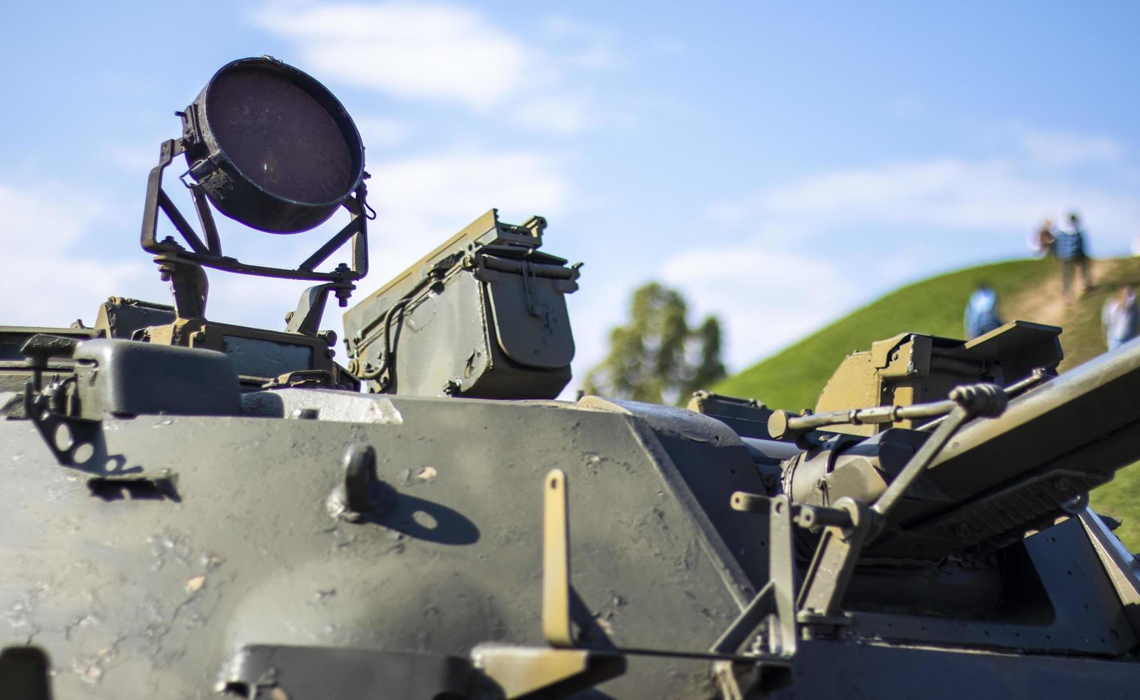Tower of an armored personnel carrier or tank. Heavy weapons of war, sky background. Army equipment for combat and defense. Cannon tower. Details of military equipment. Close-up. photo