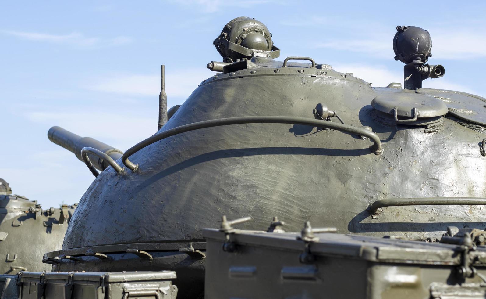 Tower of an armored personnel carrier or tank. Heavy weapons of war, sky background. Army equipment for combat and defense. Cannon tower. Details of military equipment. Close-up. photo