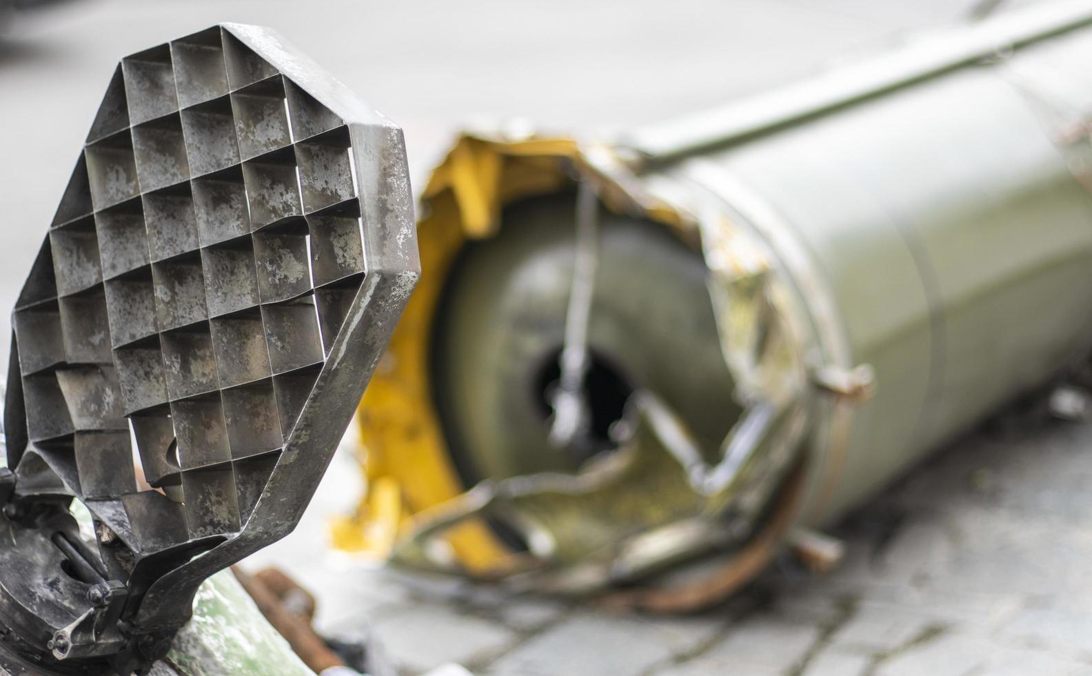 Remains of missile units of the operational-tactical missile system Tochka-U, 9M79M. The air defense system shot down a missile, part of it fell near the house. Soviet tactical bomb on the street. photo