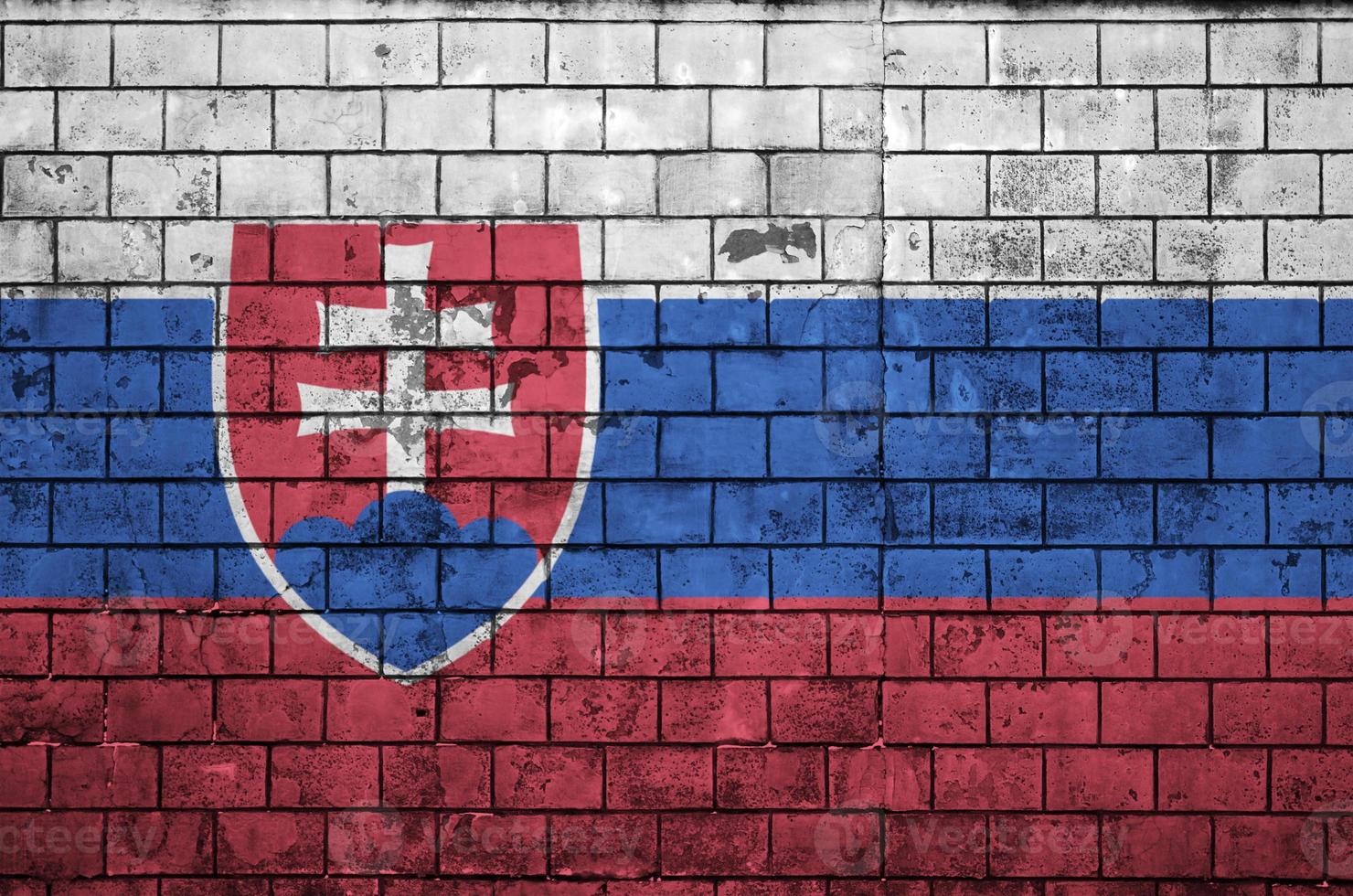 Slovakia flag is painted onto an old brick wall photo
