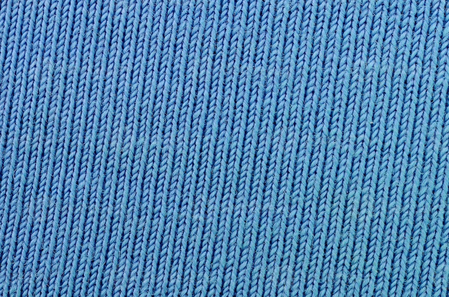 The texture of the fabric in blue color. Material for making shirts and blouses photo