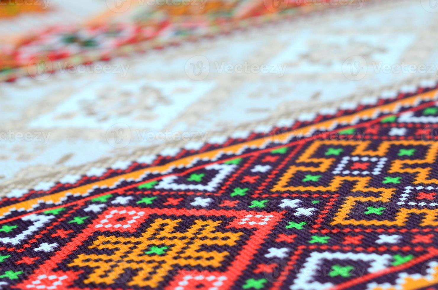 Traditional Ukrainian folk art knitted embroidery pattern on textile fabric photo