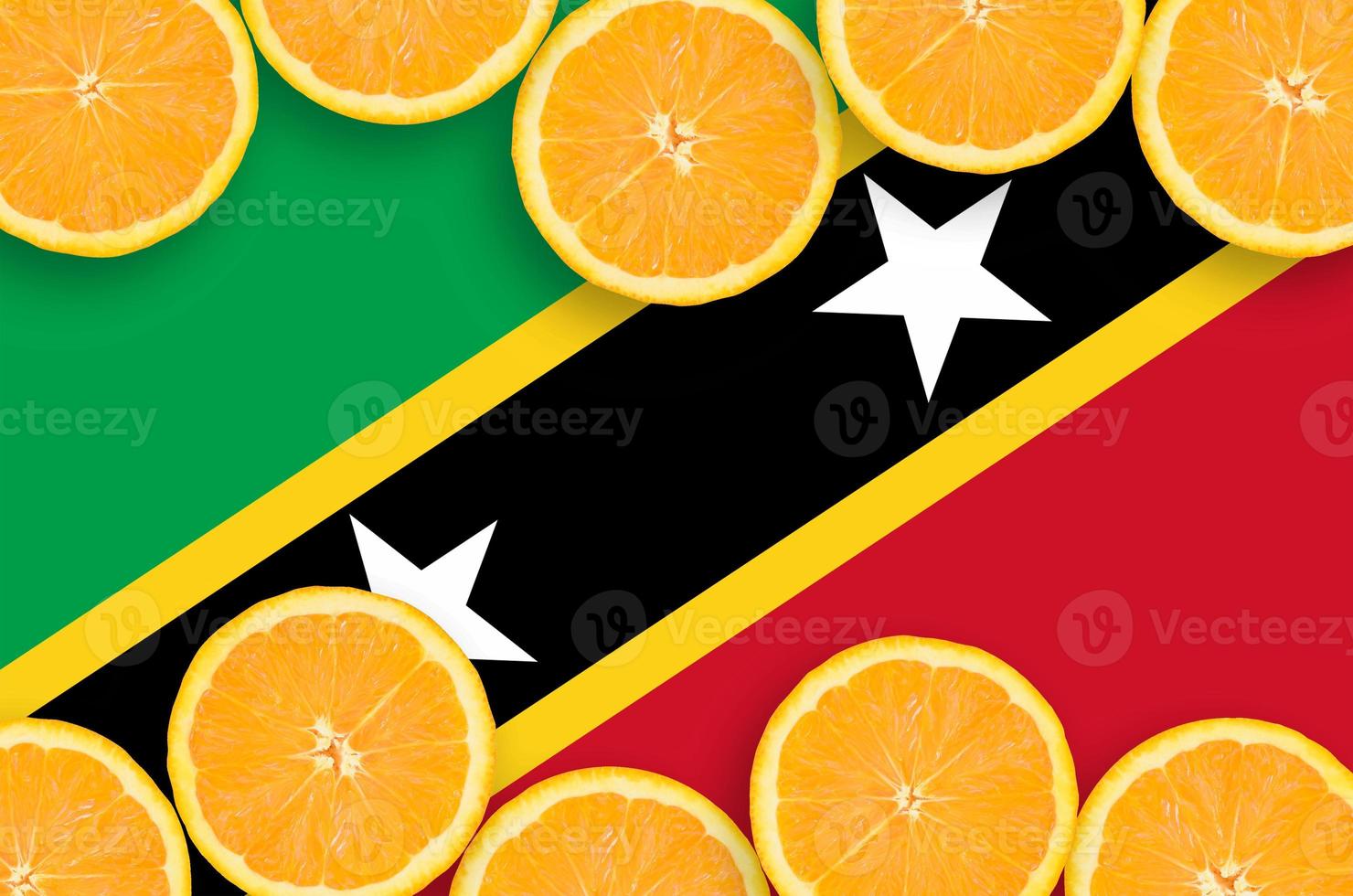 Saint Kitts and Nevis flag in citrus fruit slices horizontal frame photo