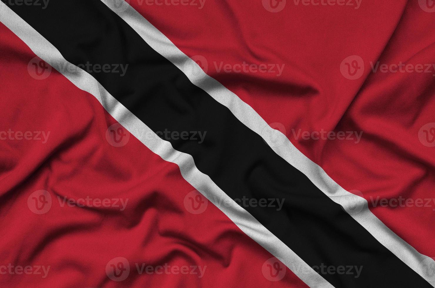 Trinidad and Tobago flag is depicted on a sports cloth fabric with many folds. Sport team banner photo