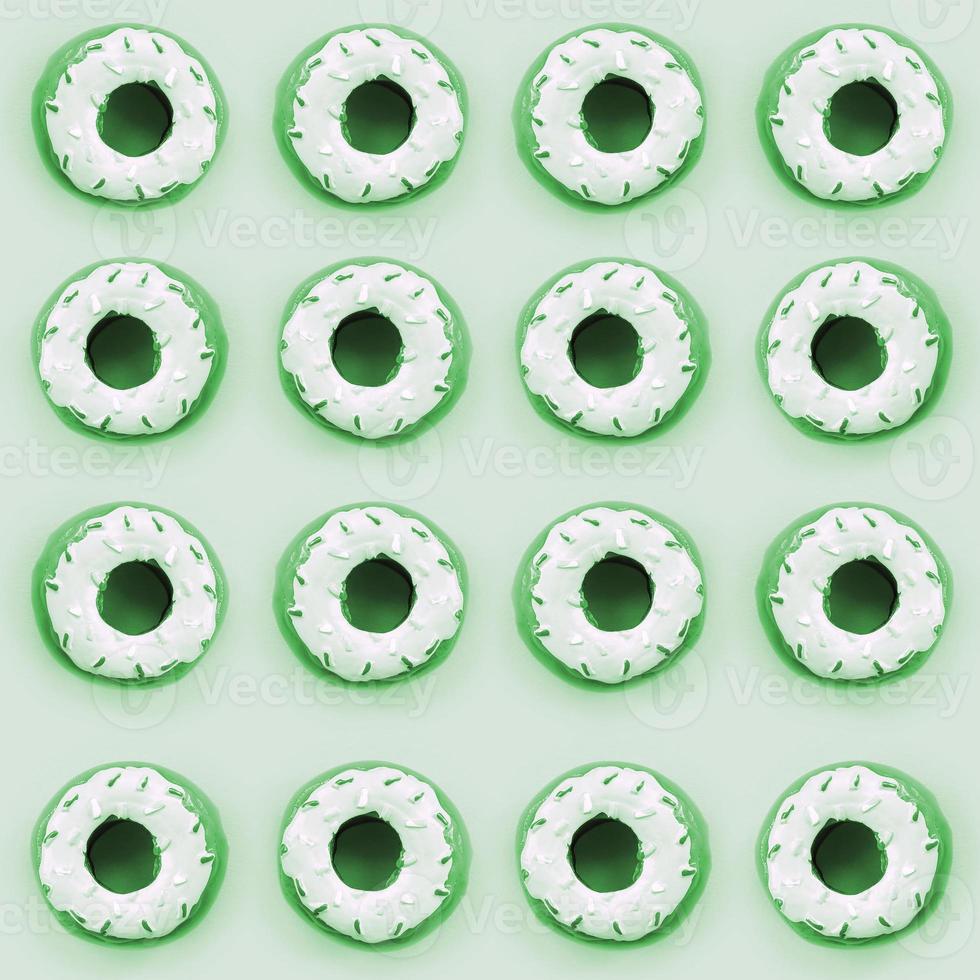 Many small plastic donuts lies on a pastel colorful background. Flat lay minimal pattern. Top view photo