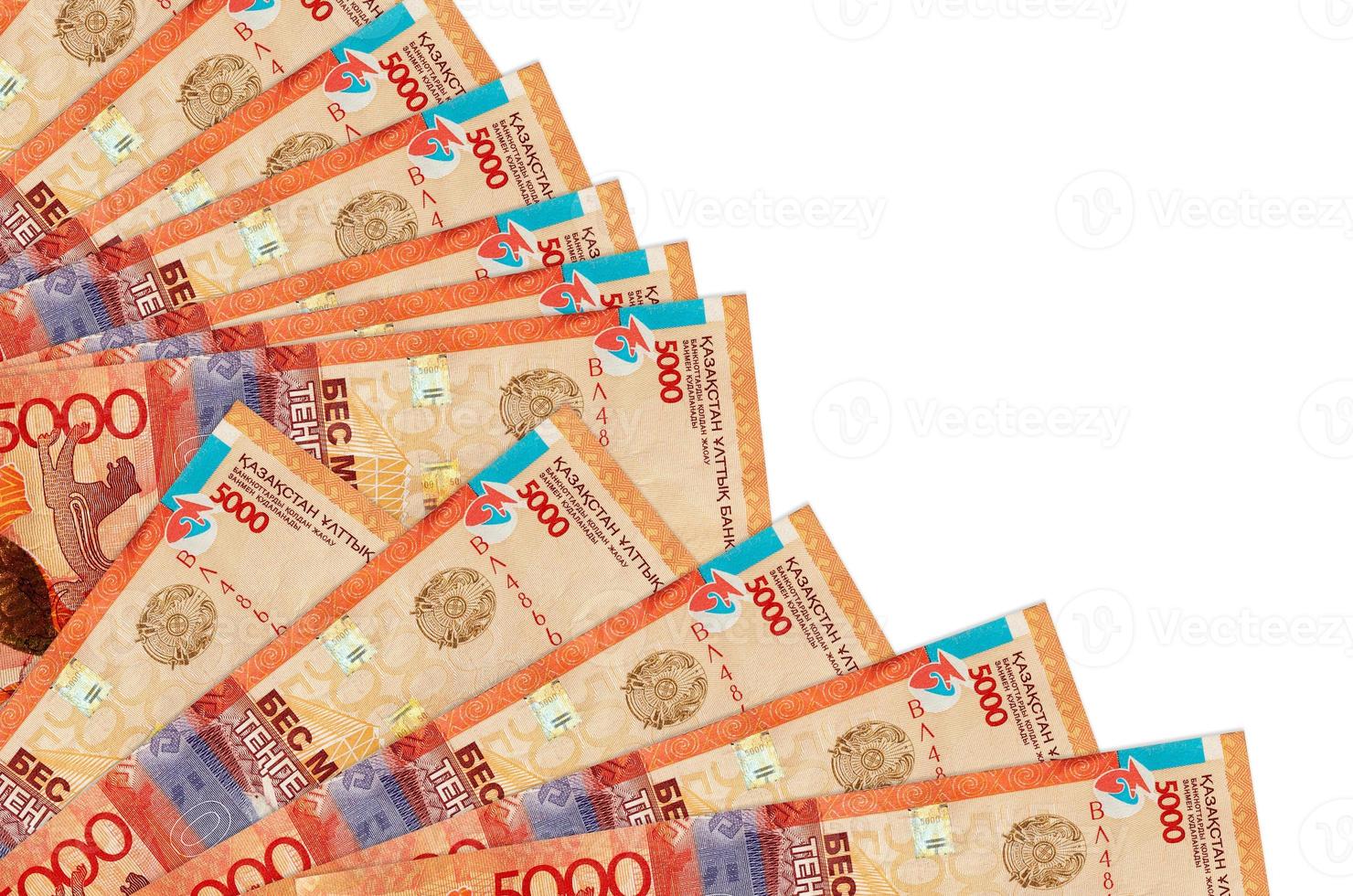5000 Kazakhstani tenge bills lies isolated on white background with copy space stacked in fan close up photo