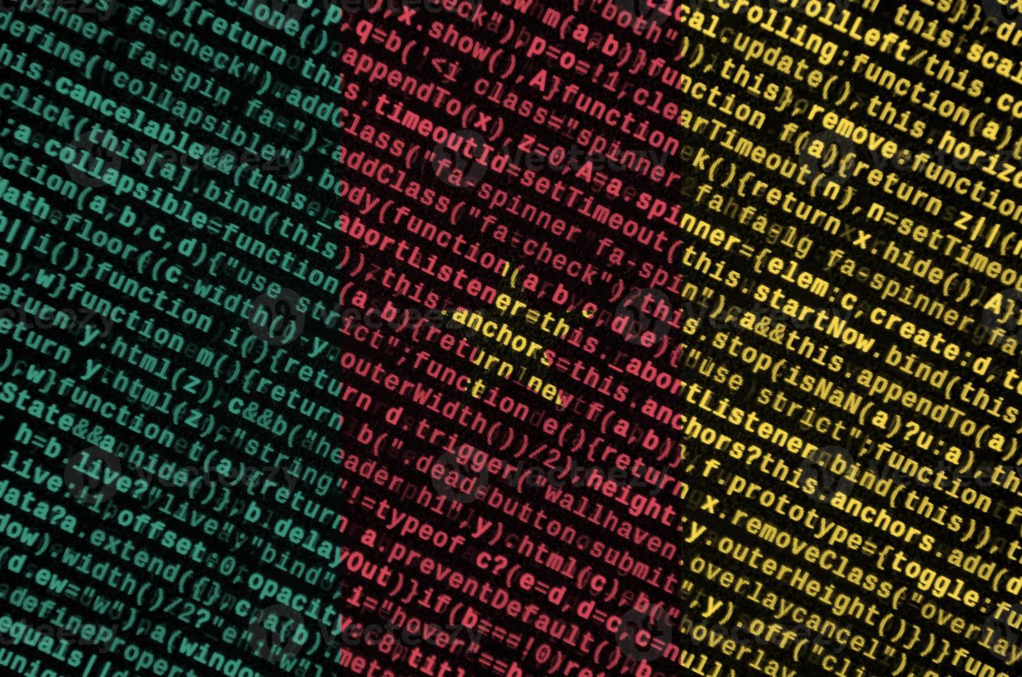 Cameroon flag is depicted on the screen with the program code. The concept of modern technology and site development photo