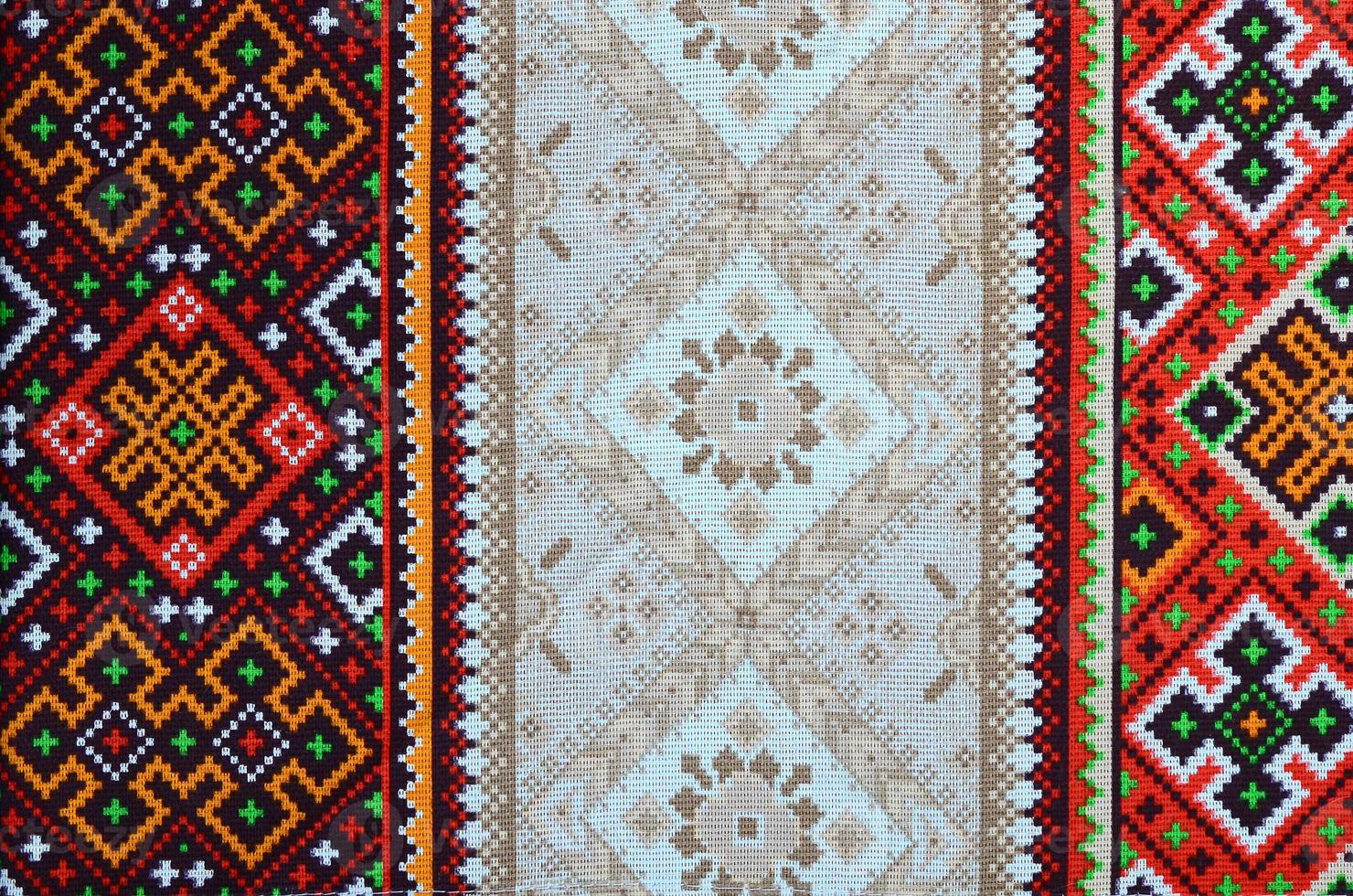 Traditional Ukrainian folk art knitted embroidery pattern on textile fabric photo