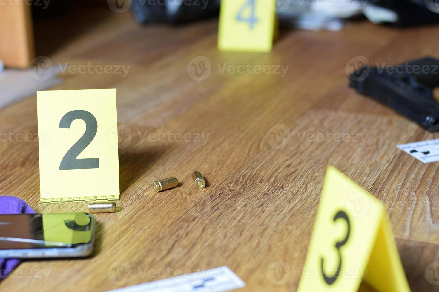 Id tents at crime scene after gunfight indoors. Gun cartridges as evidence on crime scene investigation process photo