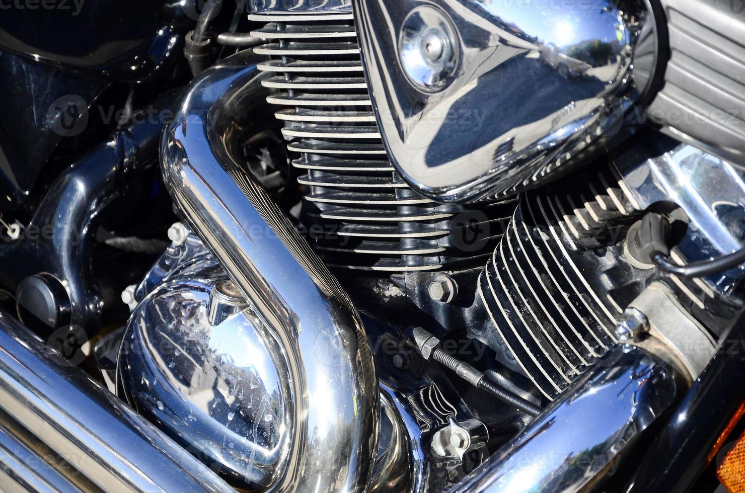 Fragment of chromed shiny body part of old classic motorbike photo