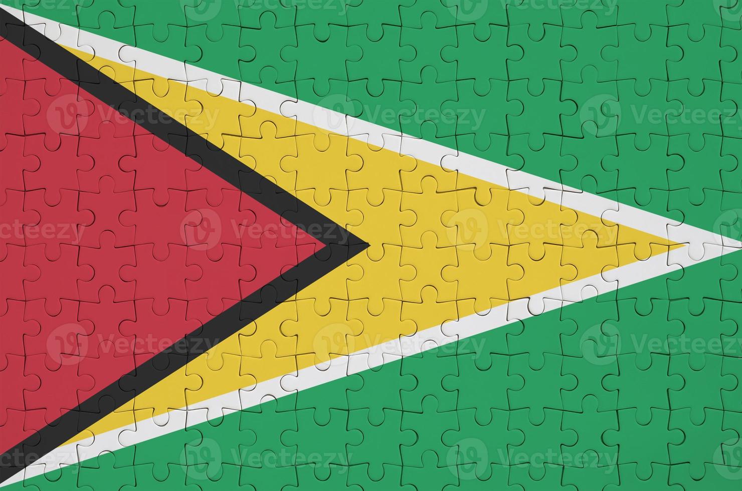 Guyana flag is depicted on a folded puzzle photo