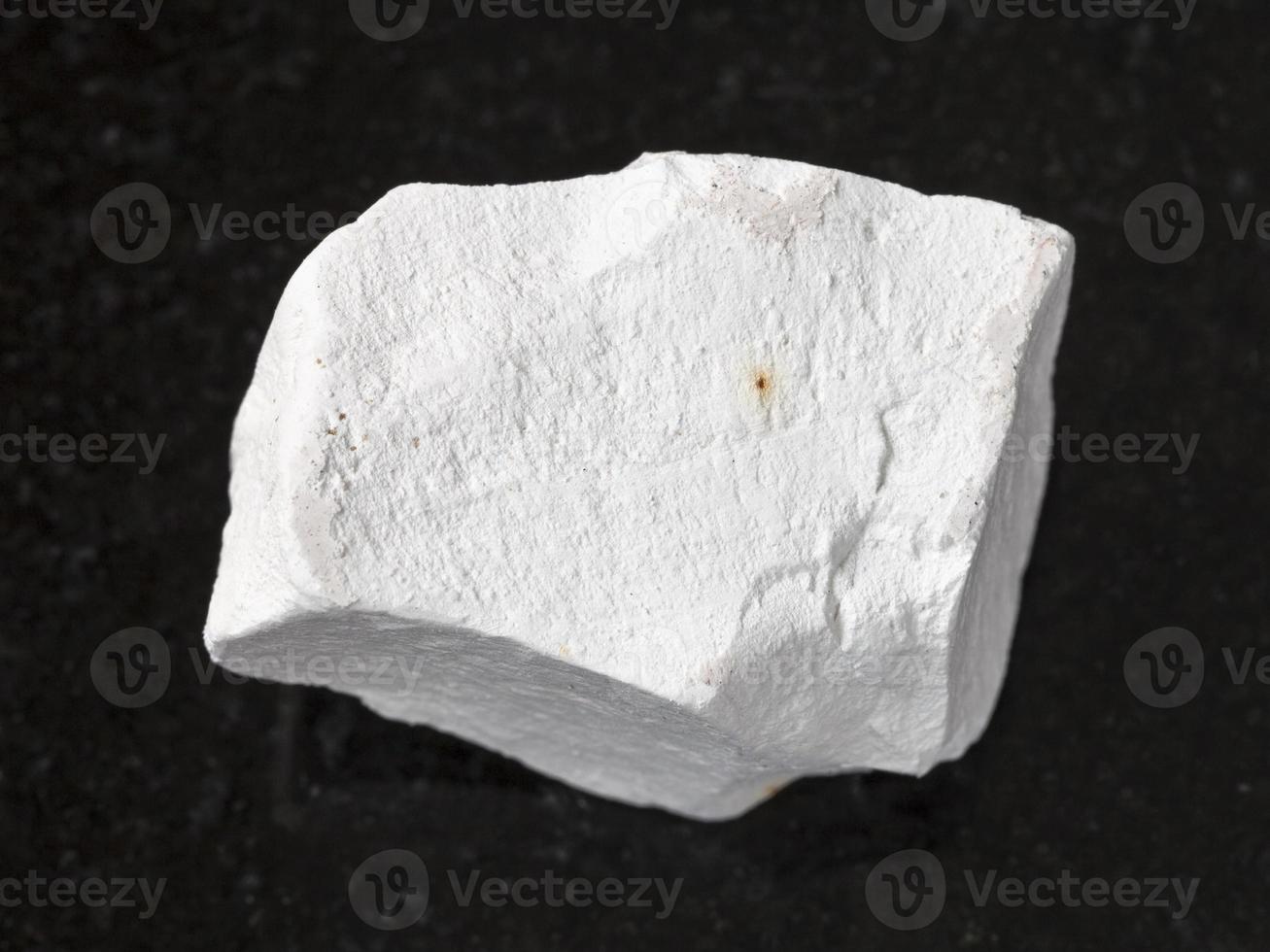 rough chalkstone on dark background photo