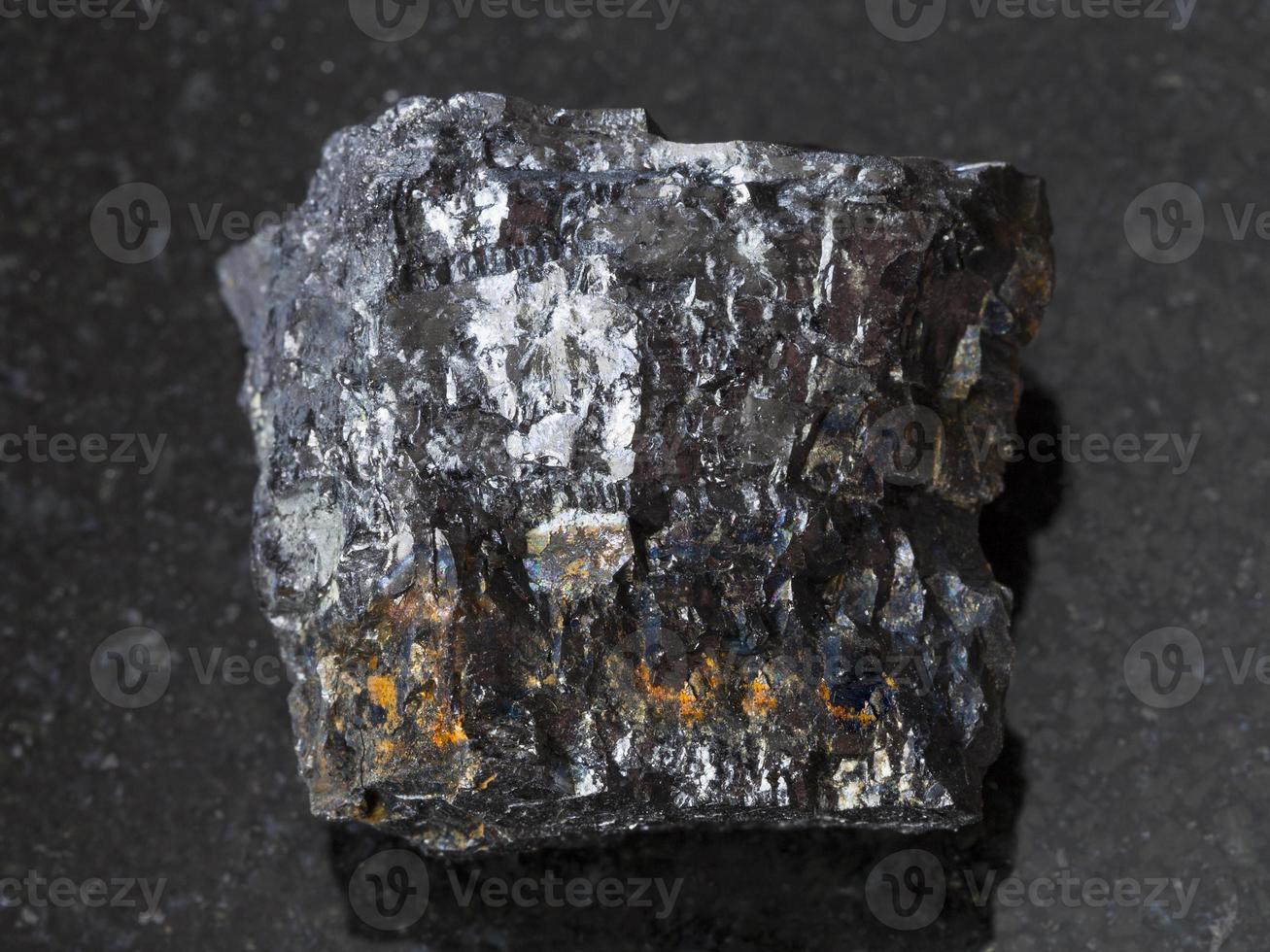 raw Bituminous coal stone on dark background photo