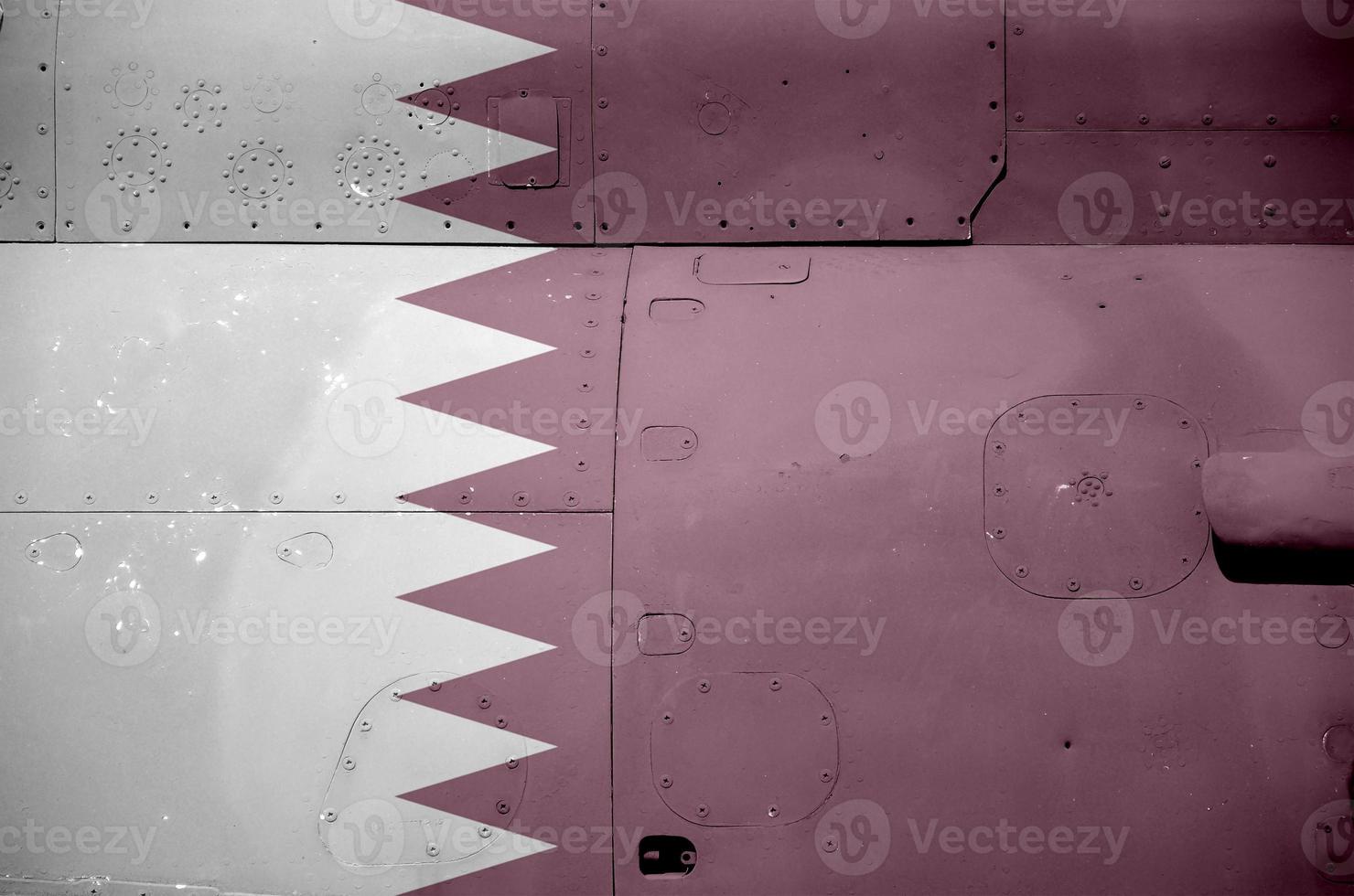Qatar flag depicted on side part of military armored helicopter closeup. Army forces aircraft conceptual background photo