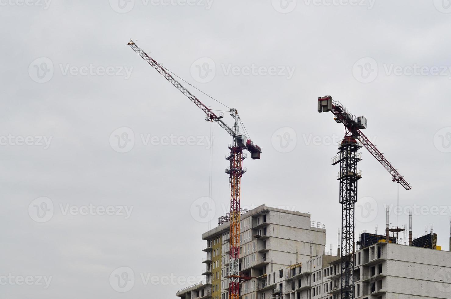Building under construction with crane photo