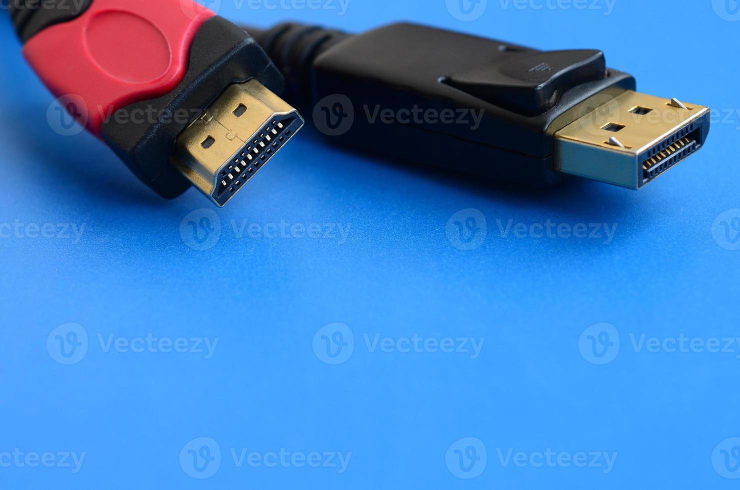 Audio video HDMI computer cable plug and 20-pin male DisplayPort gold plated connector for a flawless connection on a blue background photo