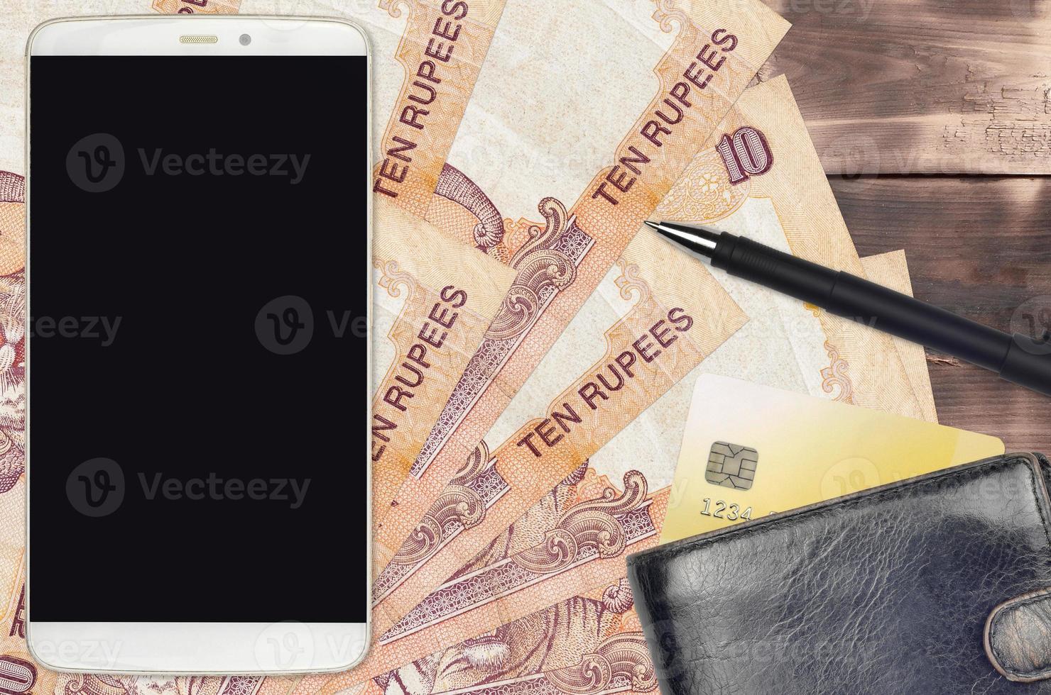 10 Indian rupees bills and smartphone with purse and credit card. E-payments or e-commerce concept. Online shopping and business with portable devices photo