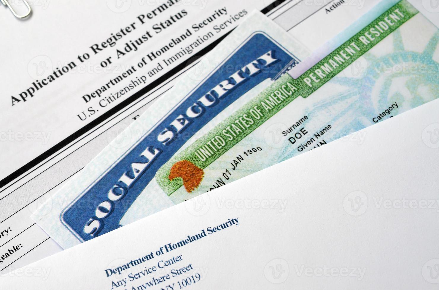 I-485 Application to register permanent residence or adjust status form and green card from dv-lottery with social security number lies with USCIS envelope photo