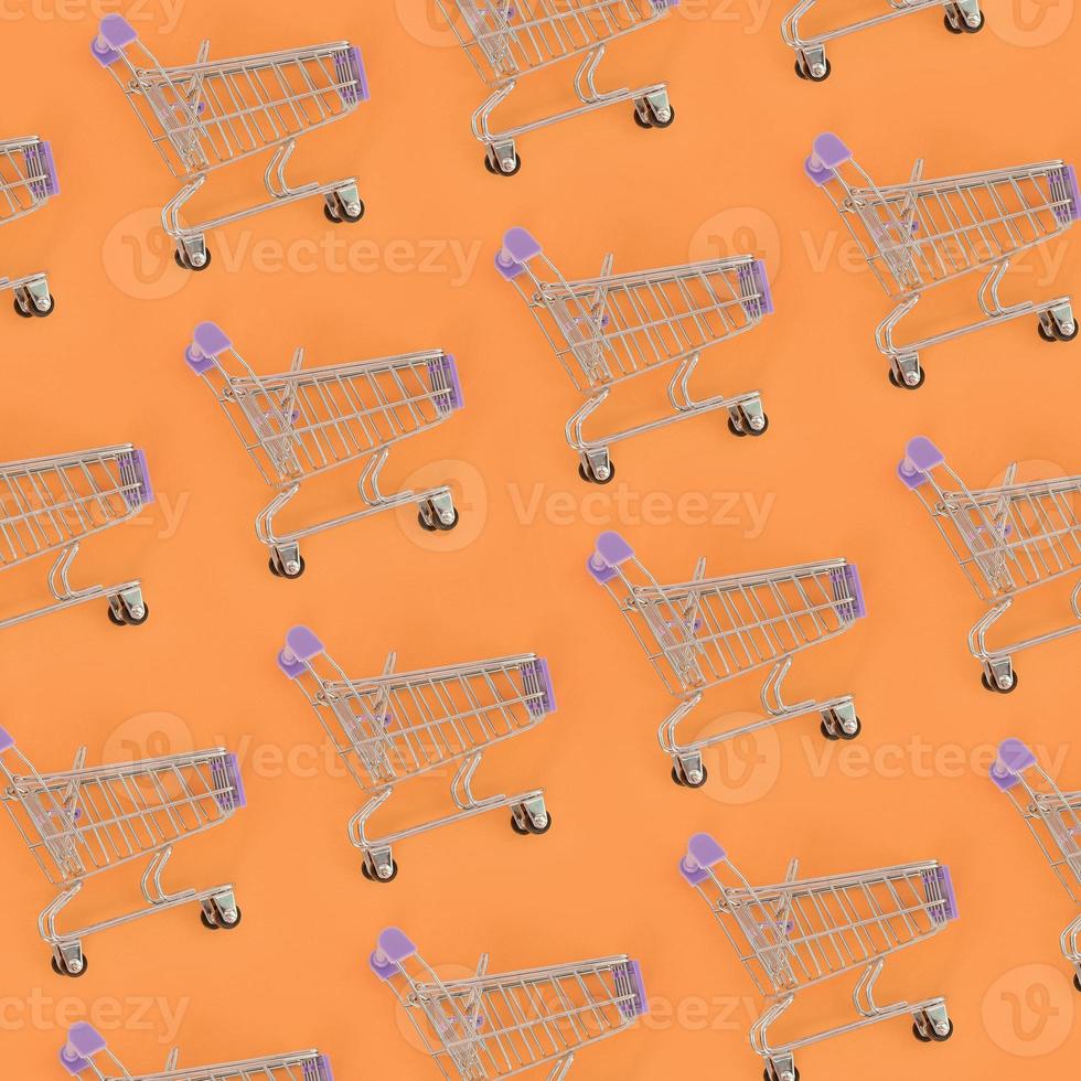 Shopping addiction, shopping lover or shopaholic concept. Many small empty shopping carts perform a pattern on a pastel colored paper background. Flat lay composition, top view photo