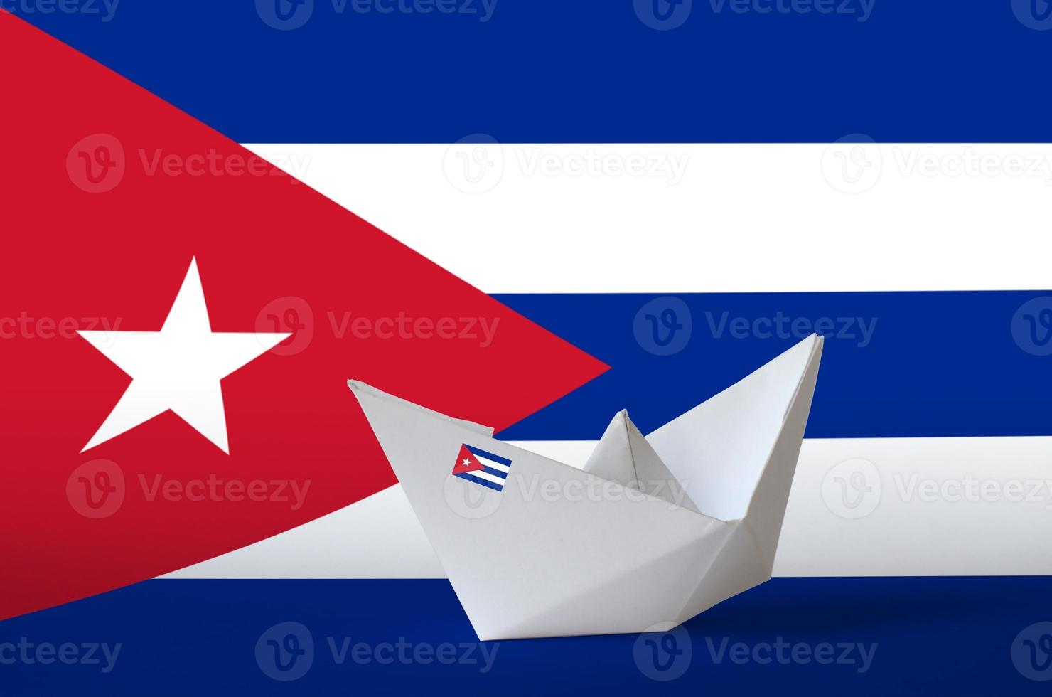 Cuba flag depicted on paper origami ship closeup. Handmade arts concept photo