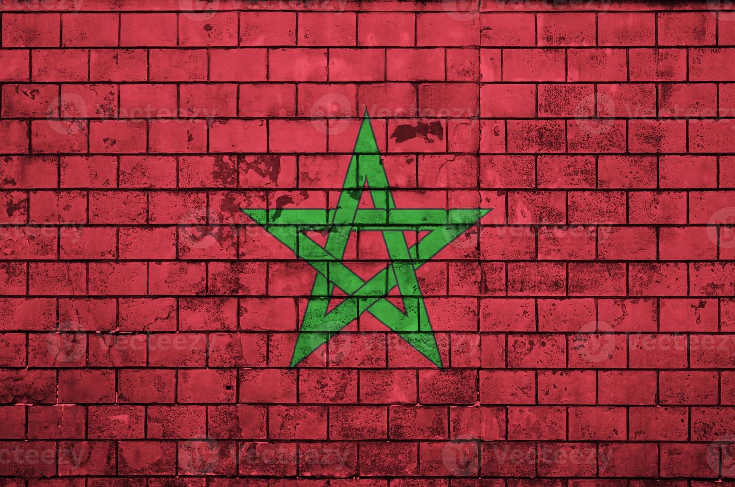 Morocco flag is painted onto an old brick wall photo