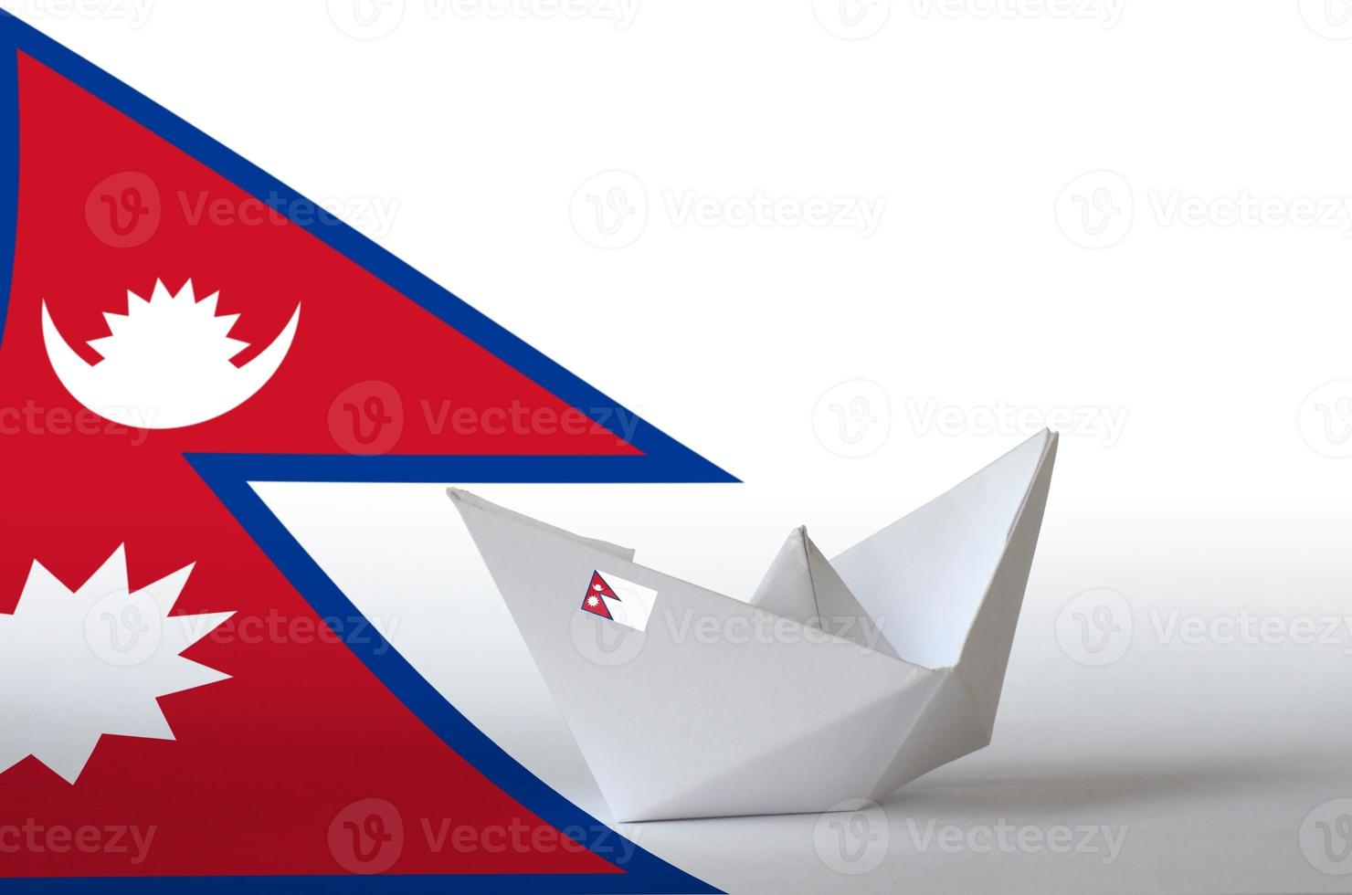 Nepal flag depicted on paper origami ship closeup. Handmade arts concept photo