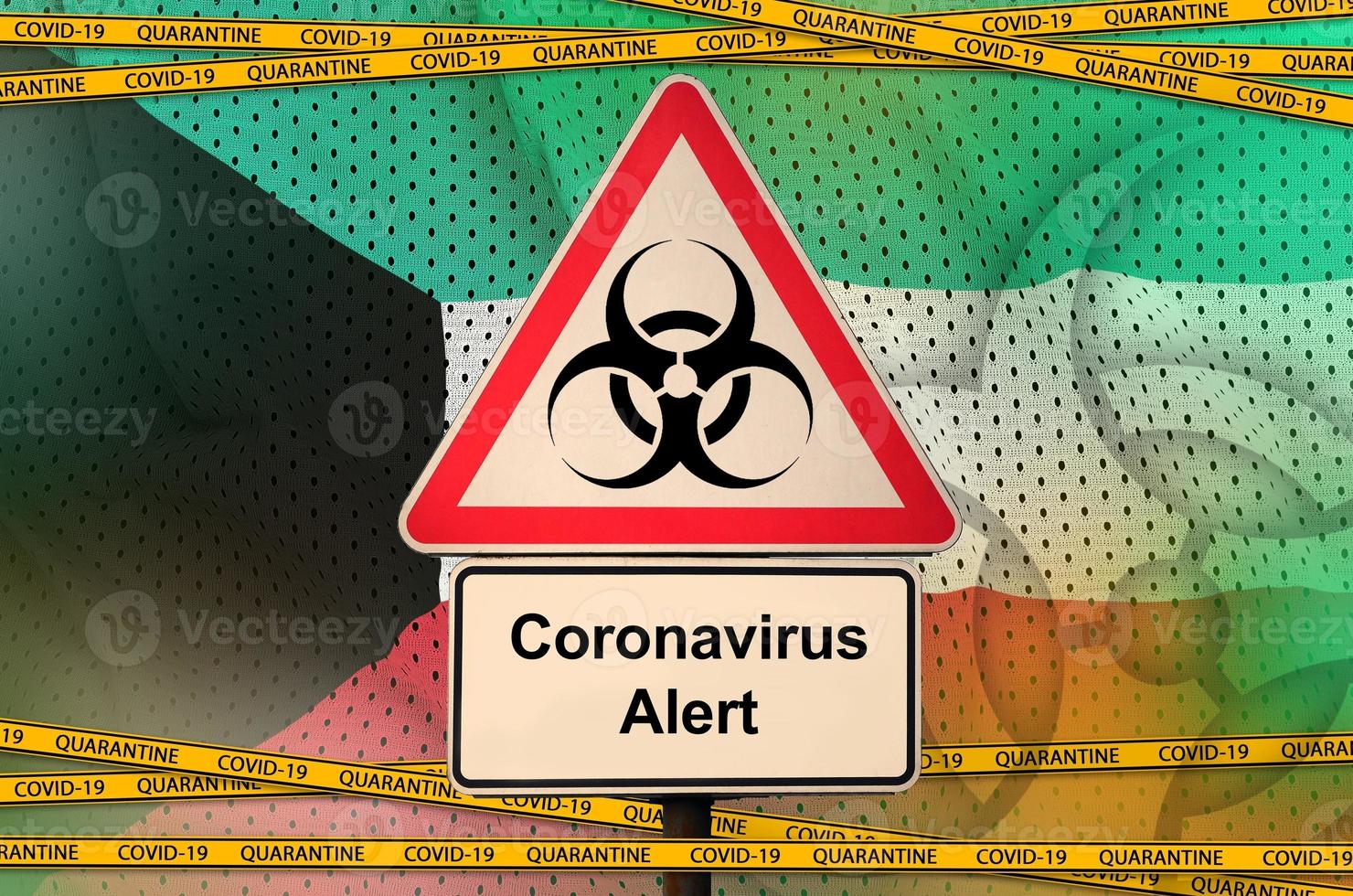 Kuwait flag and Covid-19 biohazard symbol with quarantine orange tape. Coronavirus or 2019-nCov virus concept photo