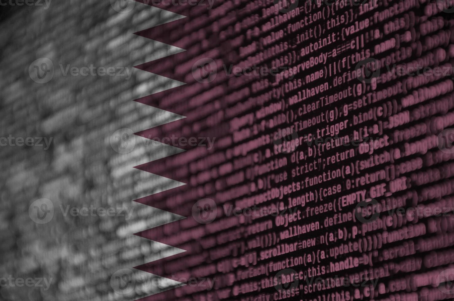 Qatar flag is depicted on the screen with the program code. The concept of modern technology and site development photo