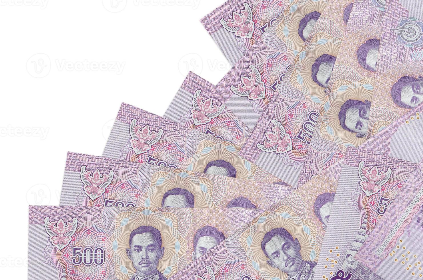 500 Thai baht bills lies in different order isolated on white. Local banking or money making concept photo