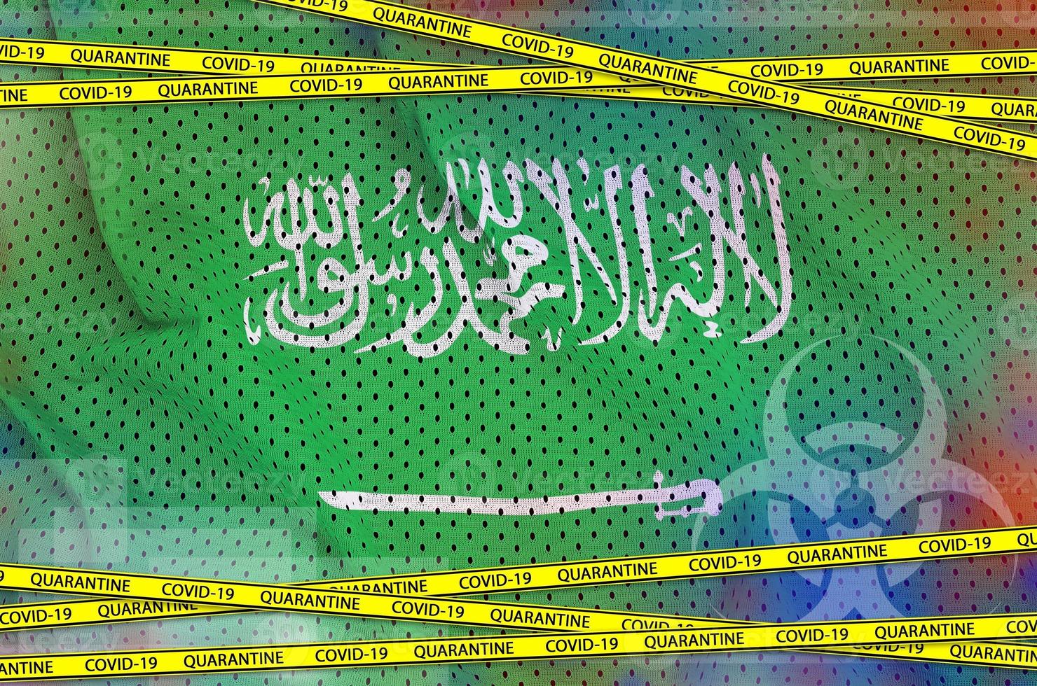 Saudi Arabia flag and Covid-19 quarantine yellow tape. Coronavirus or 2019-nCov virus concept photo