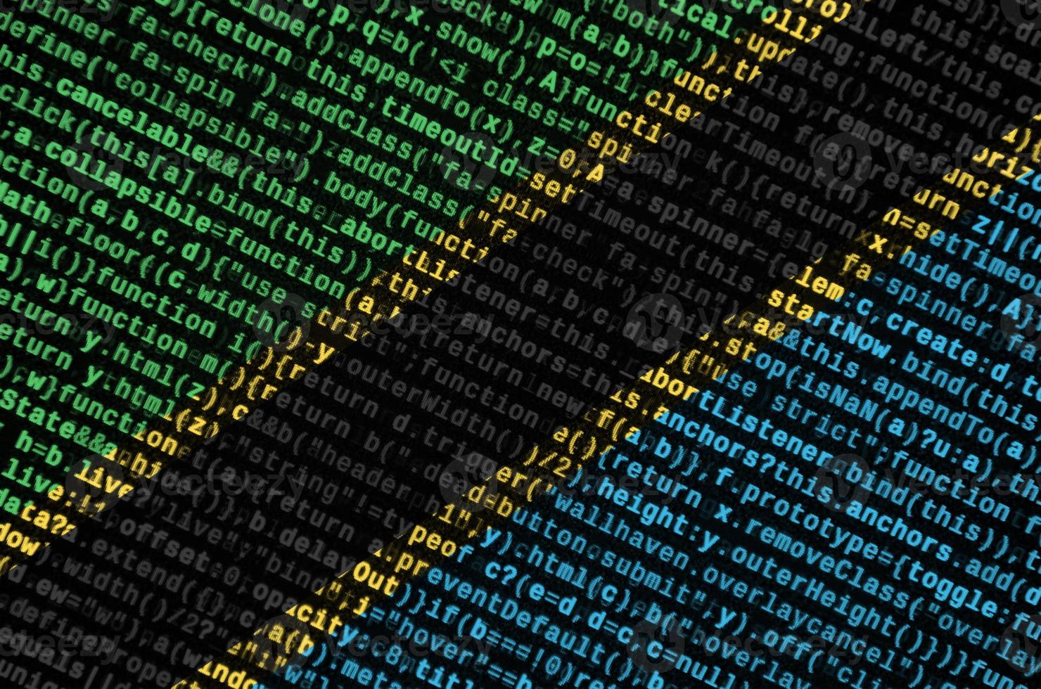 Tanzania flag is depicted on the screen with the program code. The concept of modern technology and site development photo