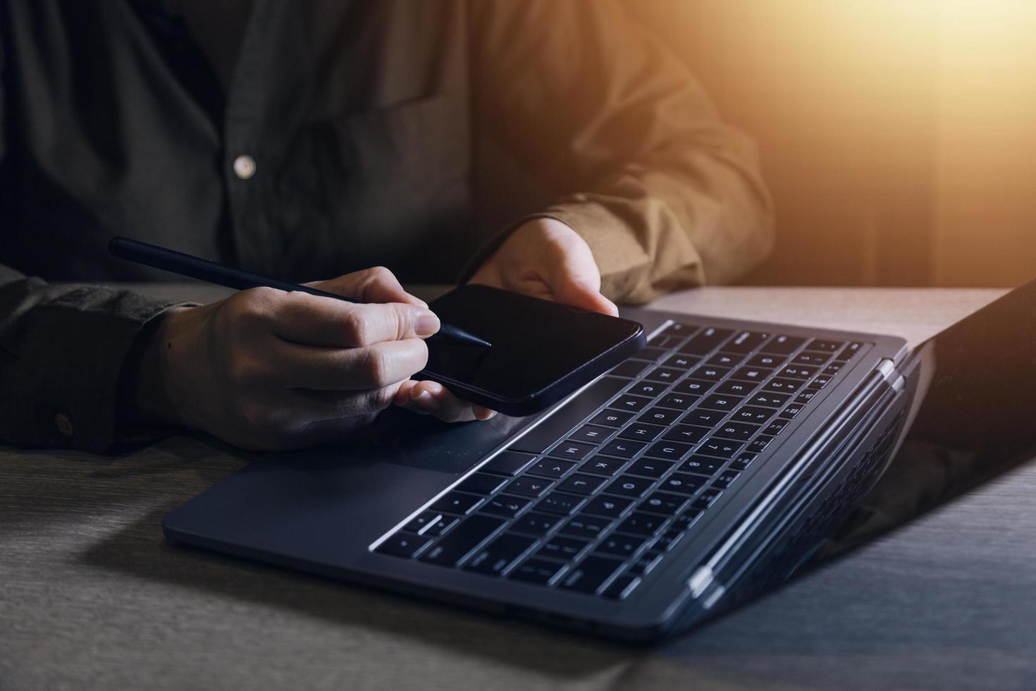 businesswoman hand working with laptop computer, tablet and smart phone in modern office with virtual icon diagram at modernoffice in morning light photo
