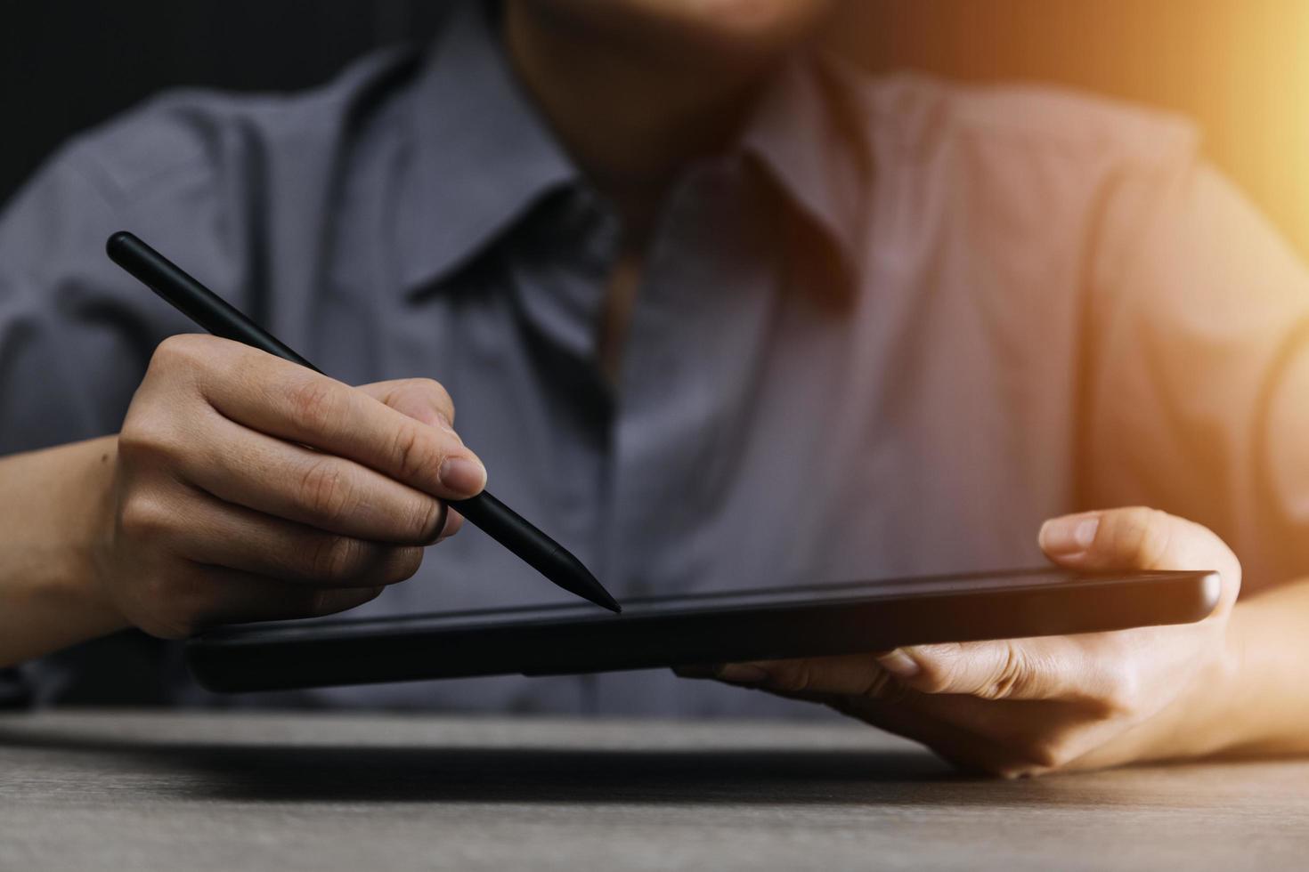 businesswoman hand working with laptop computer, tablet and smart phone in modern office with virtual icon diagram at modernoffice in morning light photo