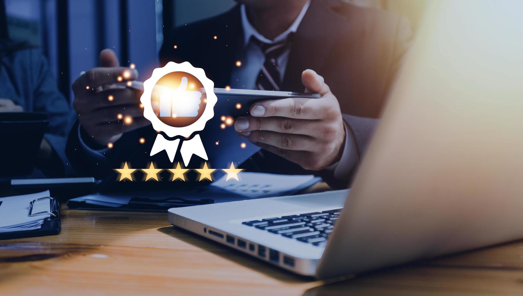Hand shows the sign of the top service Quality assurance, Guarantee, Standards, ISO certification and standardization concept, satisfaction, service experience. photo