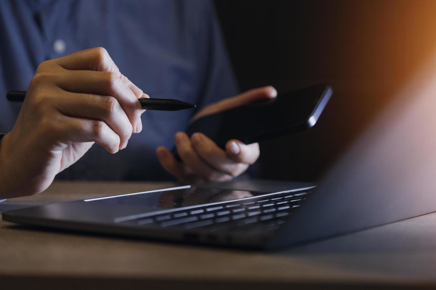 businesswoman hand working with laptop computer, tablet and smart phone in modern office with virtual icon diagram at modernoffice in morning light photo