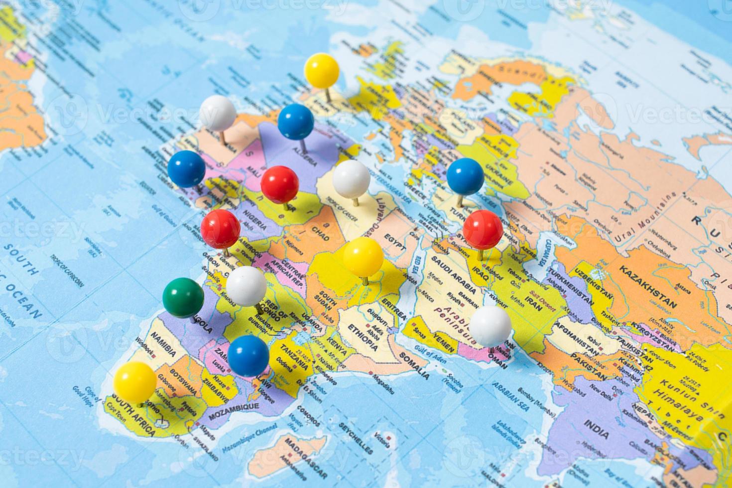 various locations with pins, push pin on map closeup photo