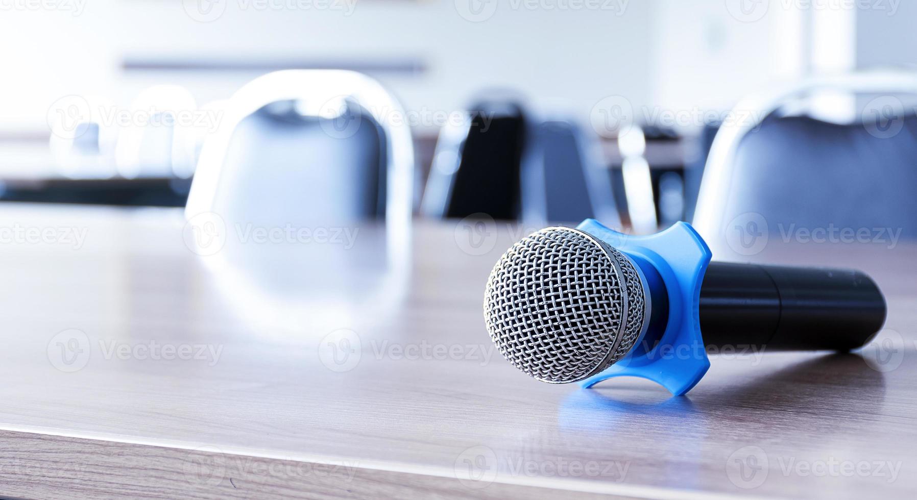 Microphone on table in seminar room and copy space photo