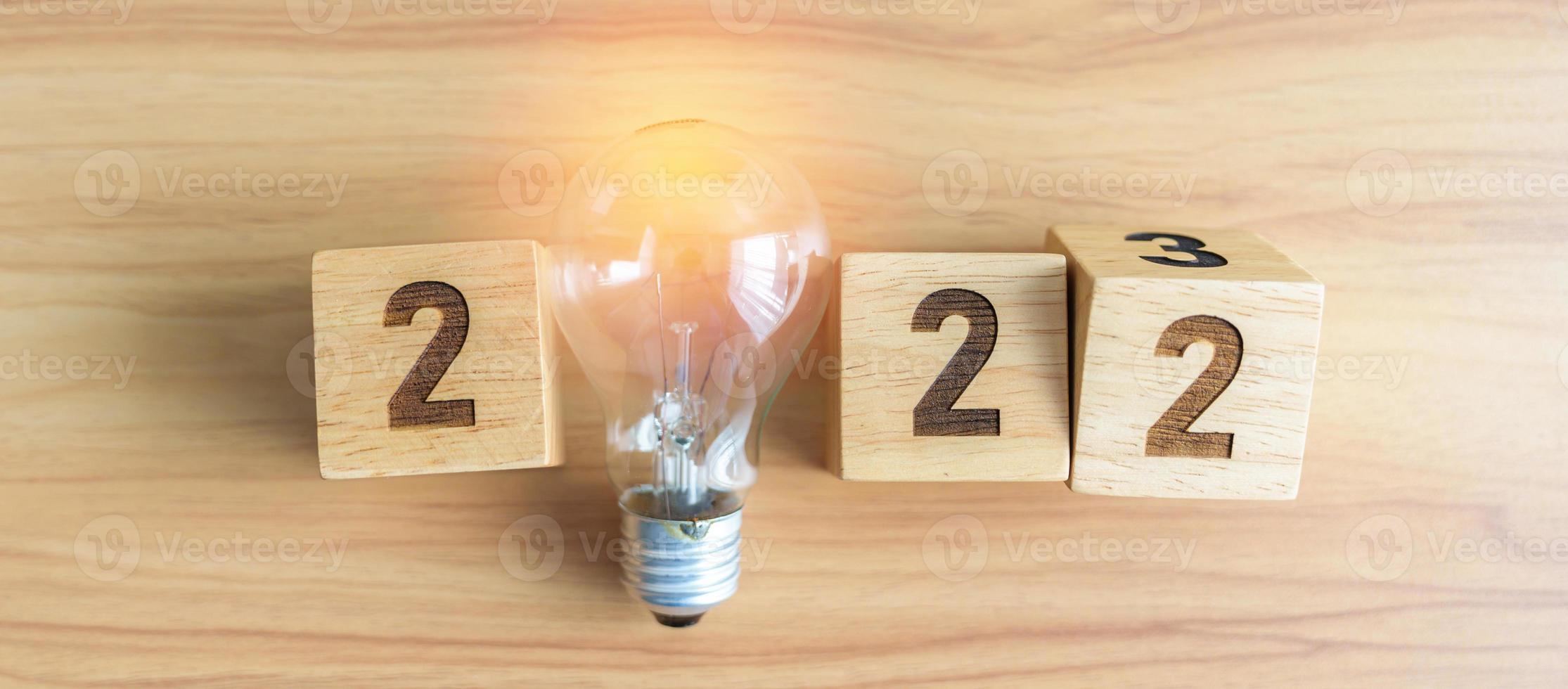 2023 block with lightbulb. Business Idea, Creative, Thinking, brainstorm, Goal, Resolution, strategy, plan, Action, change and New Year start concepts photo