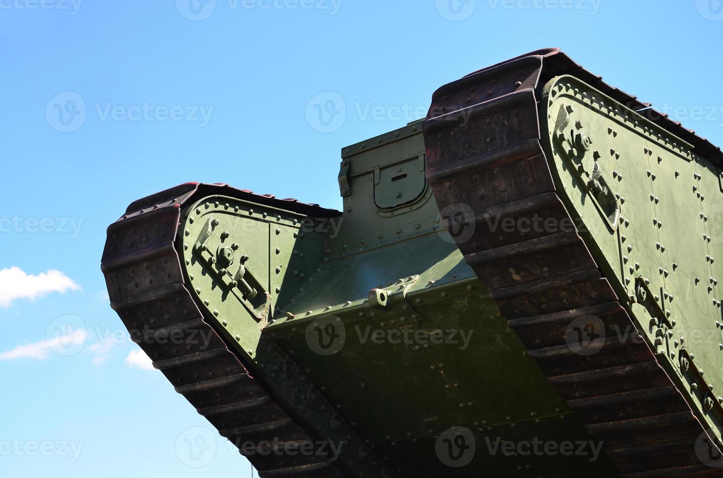 Caterpillars of the green British tank of the Russian Army Wrangel in Kharkov against the blue sky photo