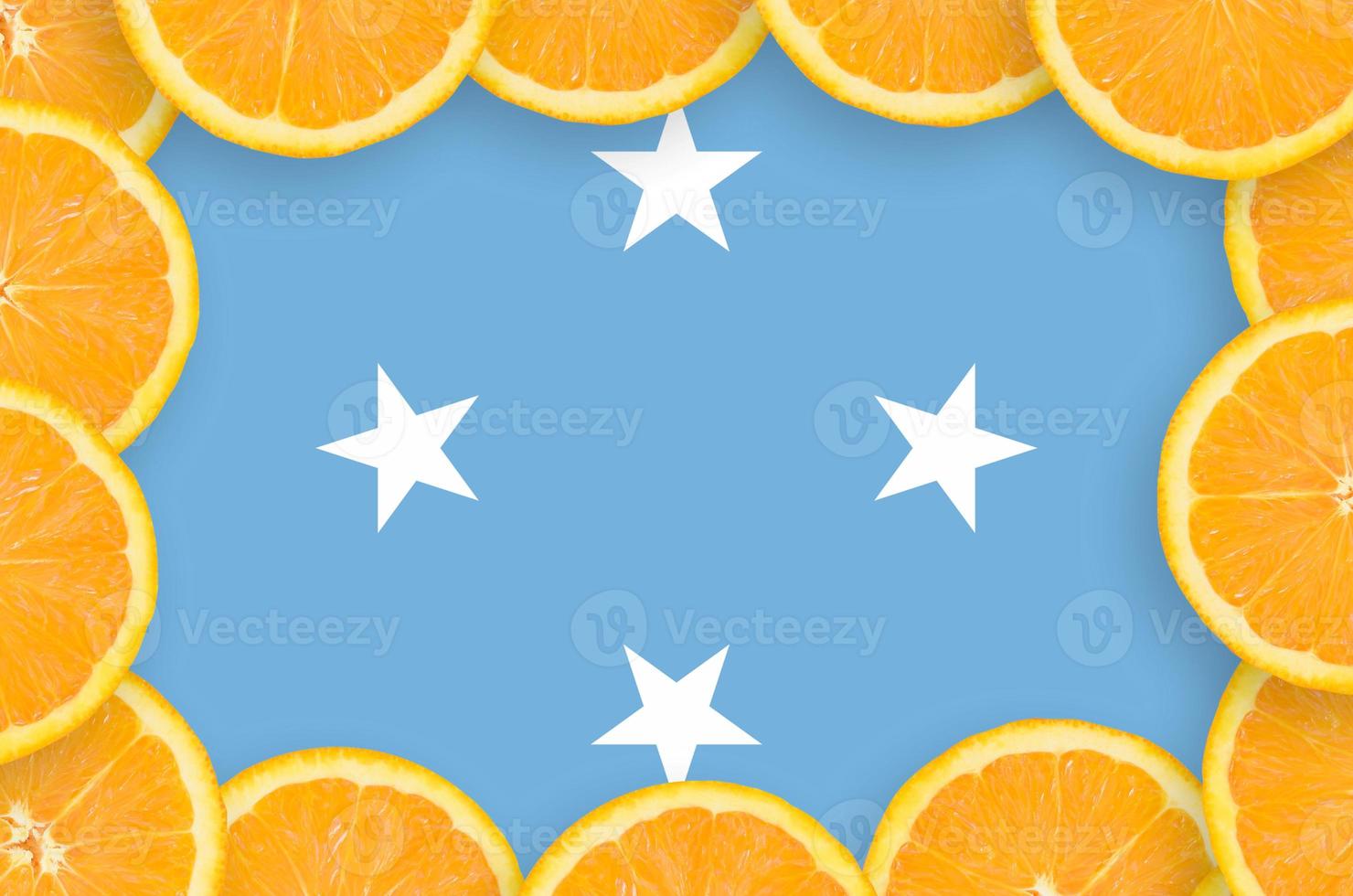 Micronesia flag in fresh citrus fruit slices frame photo