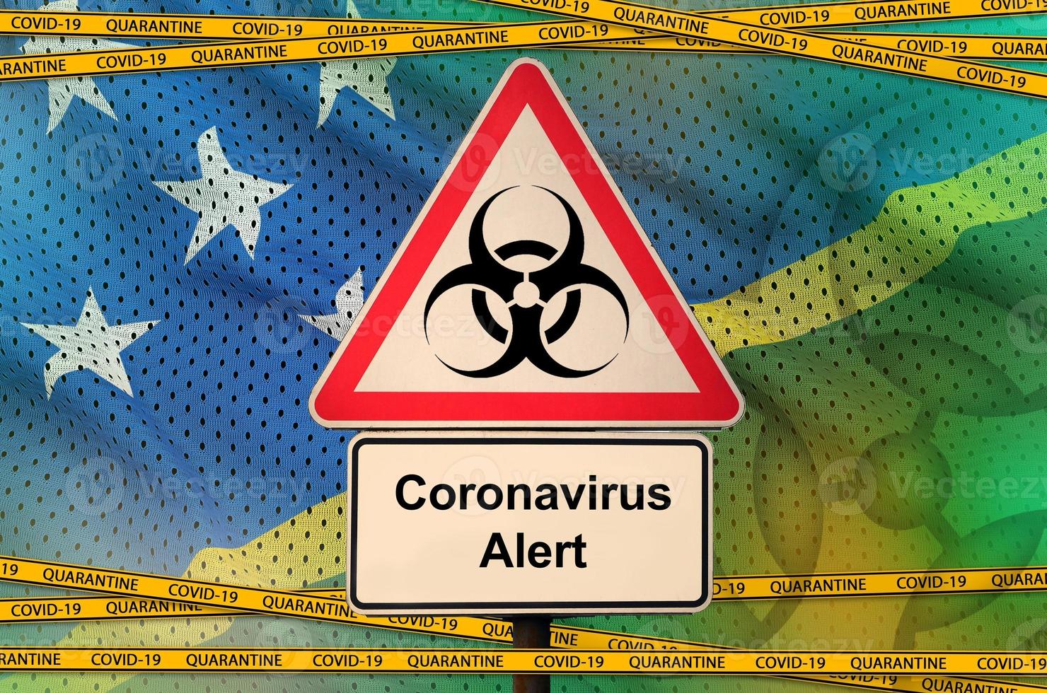 Solomon Islands flag and Covid-19 biohazard symbol with quarantine orange tape. Coronavirus or 2019-nCov virus concept photo