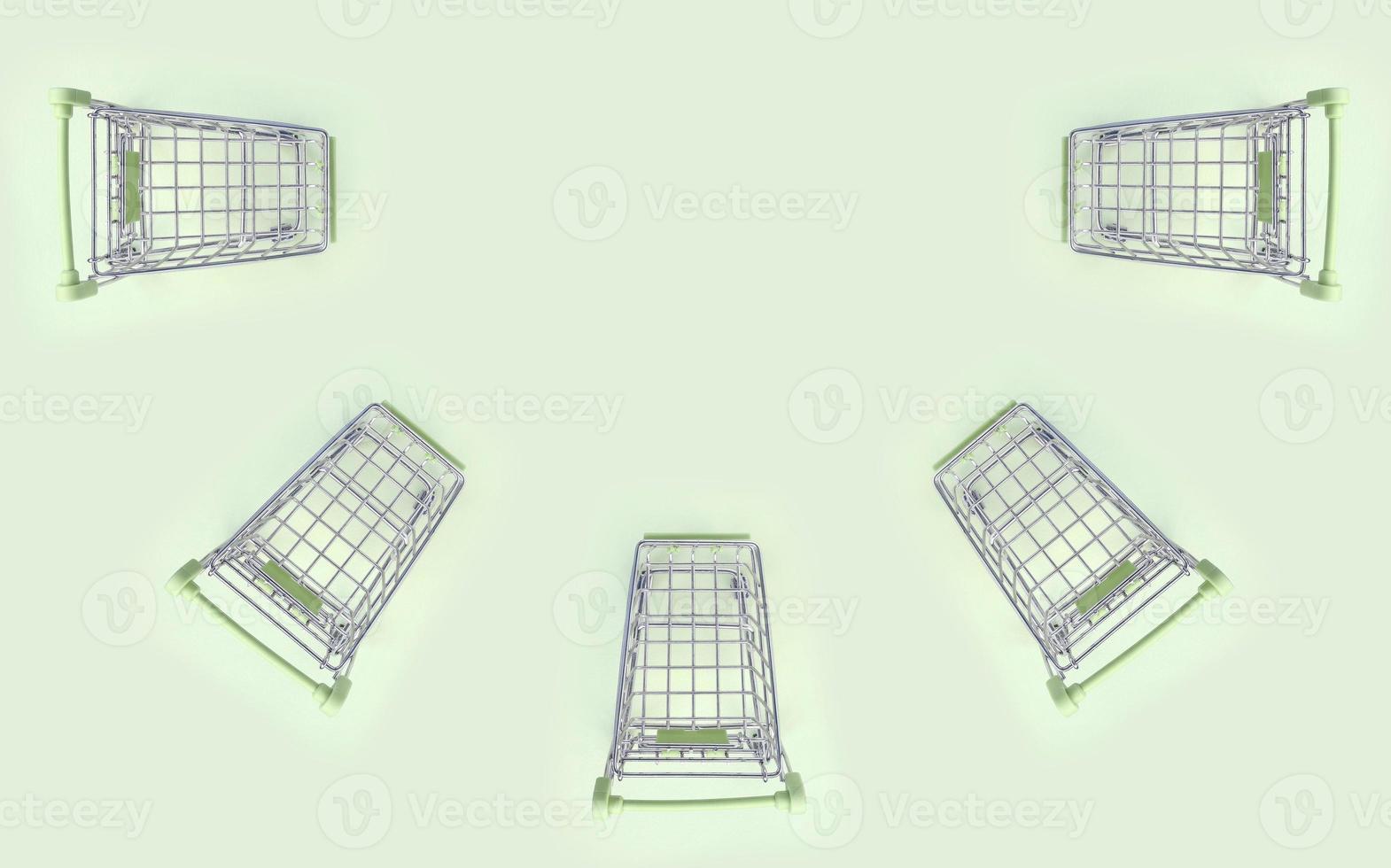 Pattern of many small shopping carts on a lime background photo