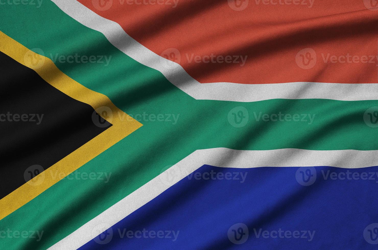 South Africa flag is depicted on a sports cloth fabric with many folds. Sport team banner photo