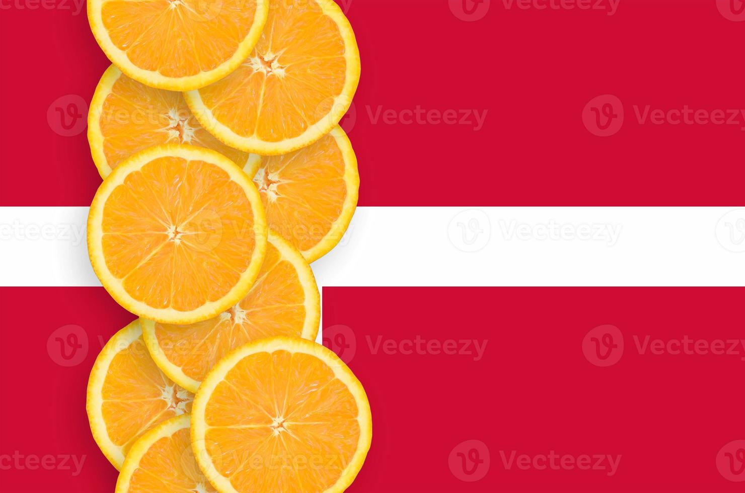 Denmark flag and citrus fruit slices vertical row photo